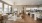 a large living room with a kitchen and dining area