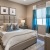 a bedroom with a bed and a fan