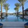 Resort-style swimming pool with lounge seating