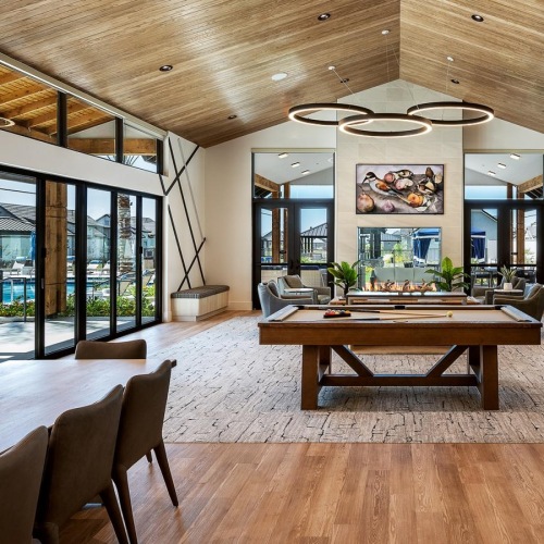 a large room with a table and chairs