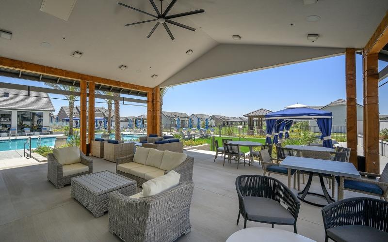 a room with a pool and chairs