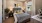 a bedroom with a bed and a fan