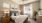 a bedroom with a bed and a fan